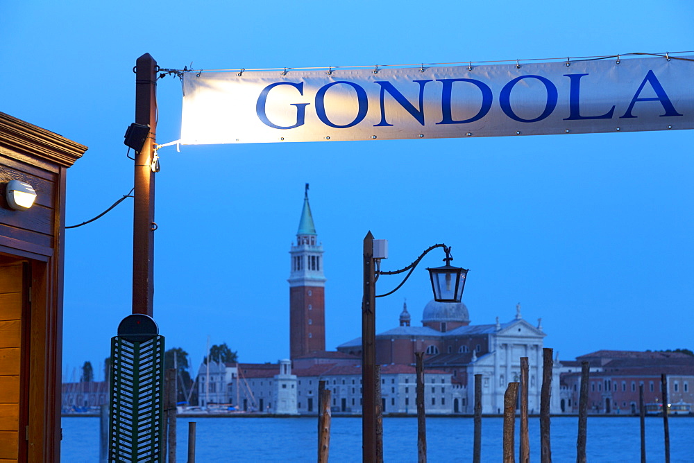 Gondola station near St. Mark's Square at night, with San Giorgio Maggiore in the distance, Venice, UNESCO World Heritage Site, Veneto, Italy, Europe