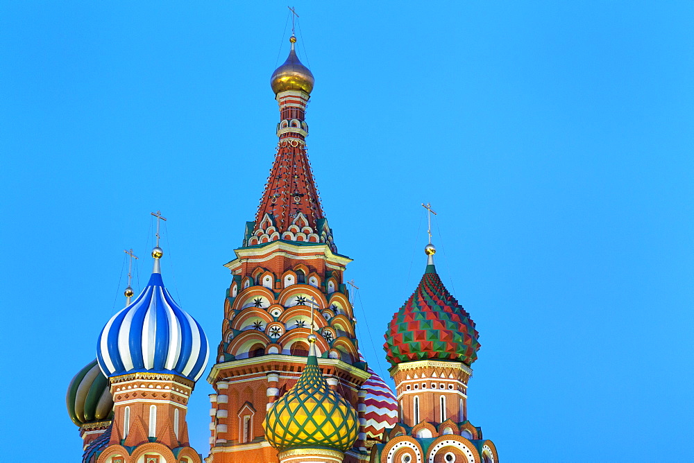 Onion domes of St. Basil's Cathedral in Red Square illuminated at night, UNESCO World Heritage Site, Moscow, Russia, Europe