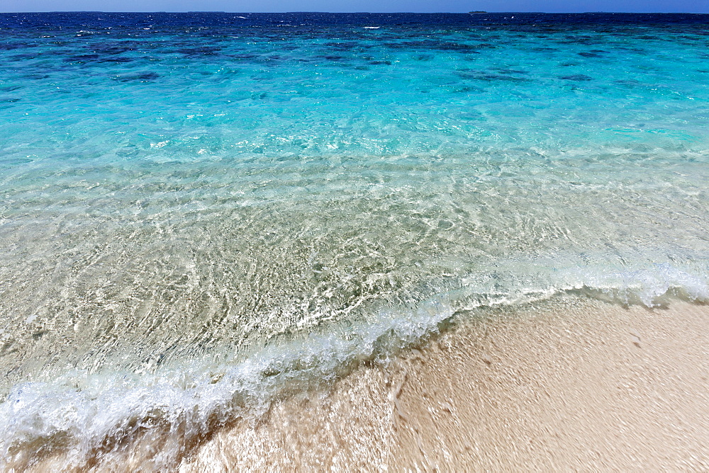 The crystal clear water of the Indian Ocean on an island in the Maldives, Indian Ocean, Asia 