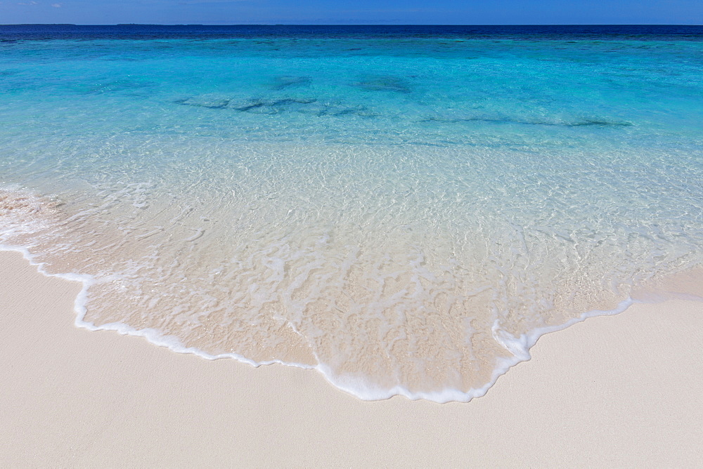 The crystal clear water of the Indian Ocean on an island in the Maldives, Indian Ocean, Asia