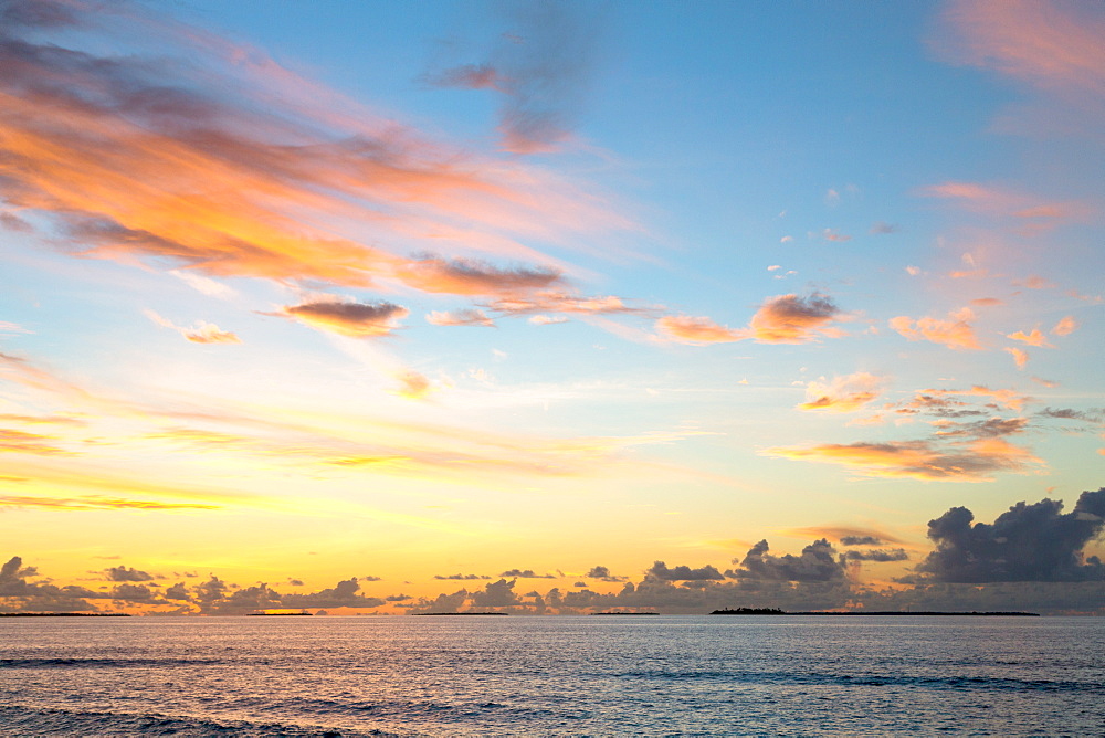 Dawn sky over the Indian Ocean from an island in the Maldives, Indian Ocean, Asia