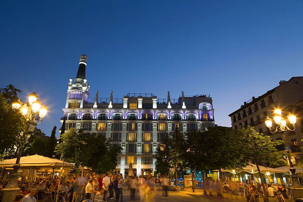 People relaxing in in the evening in Plaza de Santa Ana in Madrid, Spain, Europe