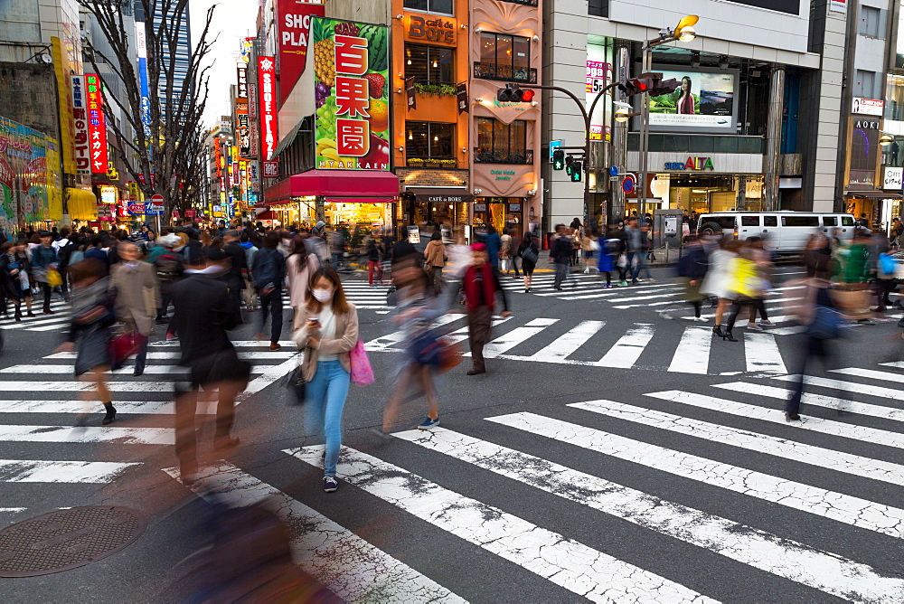 Crowds crossing a street in the Ginza district at night, Tokyo, Japan, Asia