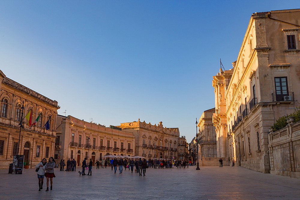 People enjoying passeggiata in Piazza Duomo on the tiny island of Ortygia, UNESCO World Heritage Site, Syracuse, Sicily, Italy, Europe