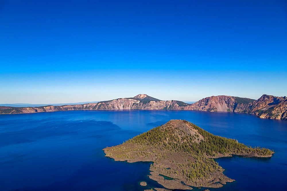 Wizard Island and the still waters of Crater Lake, the deepest lake in the U.S.A., part of the Cascade Range, Oregon, United States of America, North America