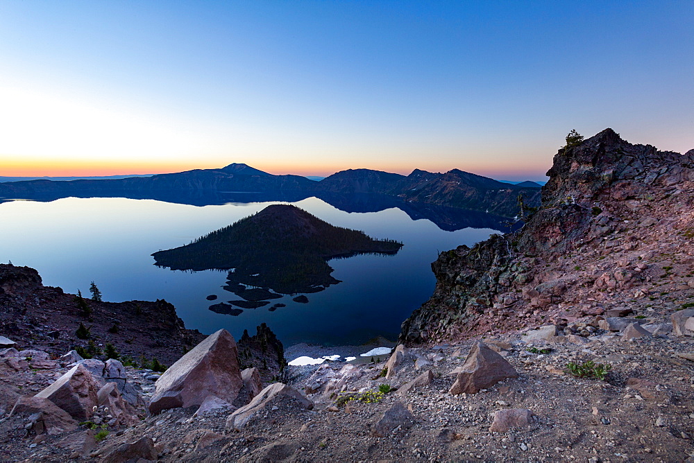 Wizard Island and the still waters of Crater Lake at dawn, the deepest lake in the U.S.A., part of the Cascade Range, Oregon, United States of America, North America