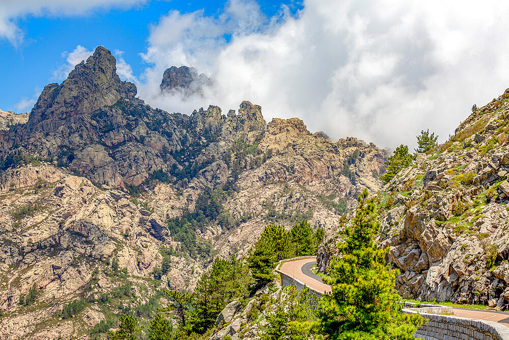 Road running through a mountain pass, past Bocca di u Pargulu, in central Corsica, France, Mediterranean, Europe