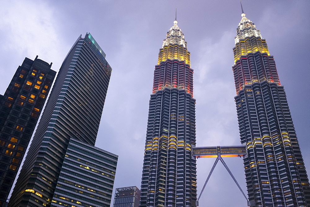 Kuala Lumpur skyline with the Petronas Twin Towers, designed by Cesar Pelli, illuminated at dusk, Kuala Lumpur, Malaysia, Southeast Asia, Asia