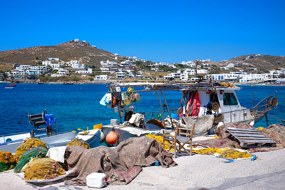 Traditional fishing boat moored in the harbour at Ornos Beach, Mykonos, The Cyclades, Aegean Sea, Greek Islands, Greece, Europe