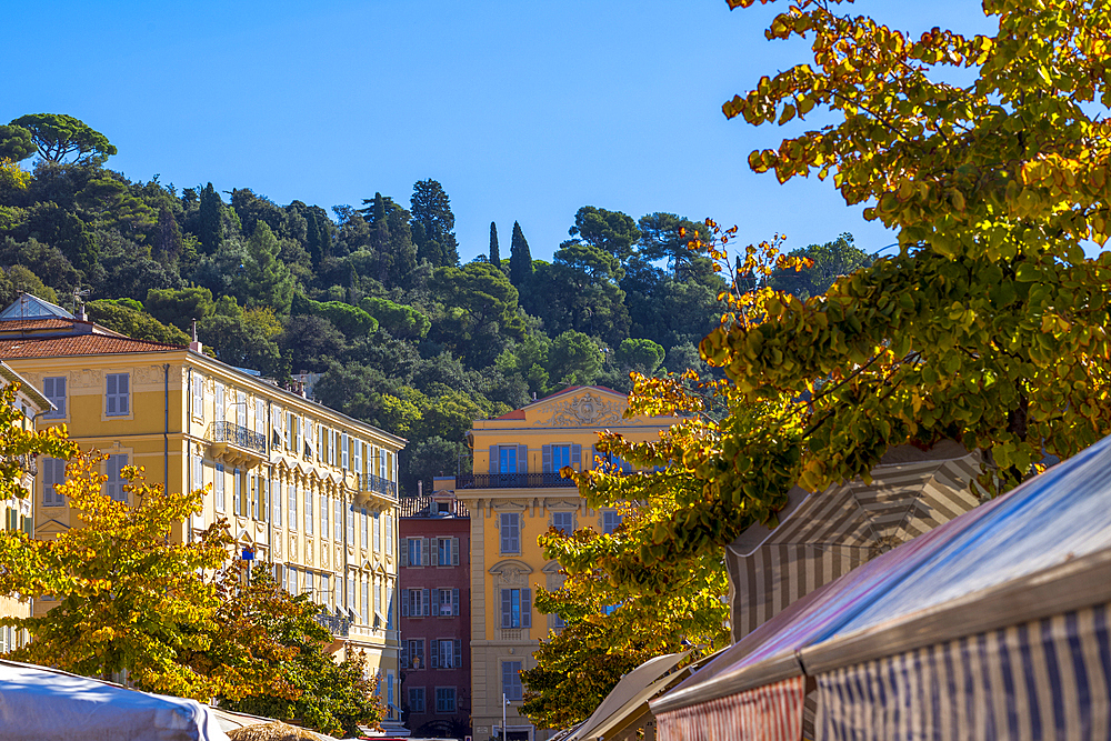 Traditional, colourful buildings above Marche Aux Fleurs (flower market), Cours Saleya, Nice, French Riviera