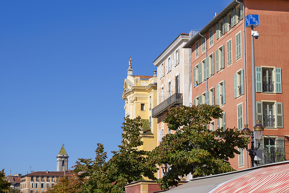 Colourful buildings above Marche Aux Fleurs (flower market), Cours Saleya, Nice, UNESCO, Alpes Maritimes, French Riviera, Provence, France