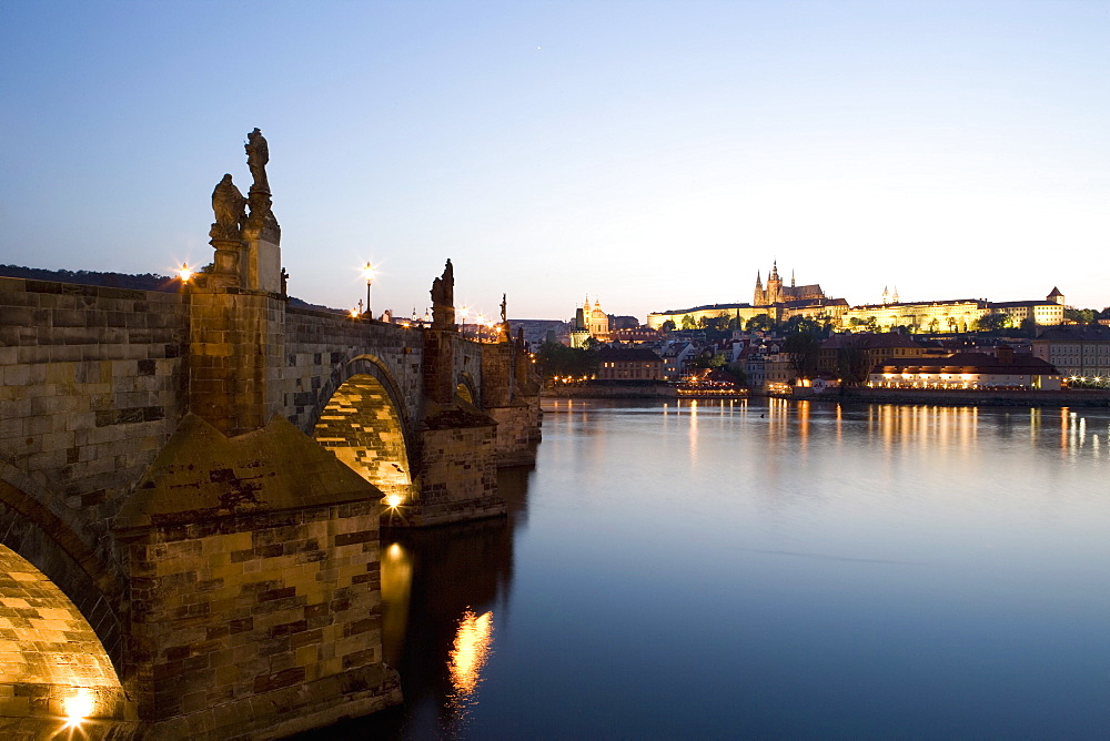 Evening light, Charles Bridge, St. Vitus's Cathedral in the distance, seen from across the River Vltava, UNESCO World Heritage Site, Prague, Czech Republic, Europe