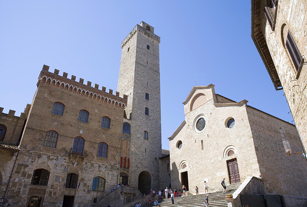 Tower, Palazzo del Popolo and fa?ade of Duomo in San Gimignano, Tuscany, Italy