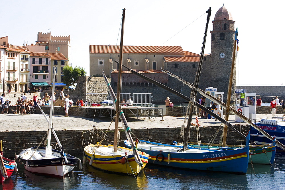 Traditional fishing boats in harbour and Eglise-Notre-Dame-des-Anges, Collioure, Pyrenees-Orientales, Cote Vermeille, France, Europe