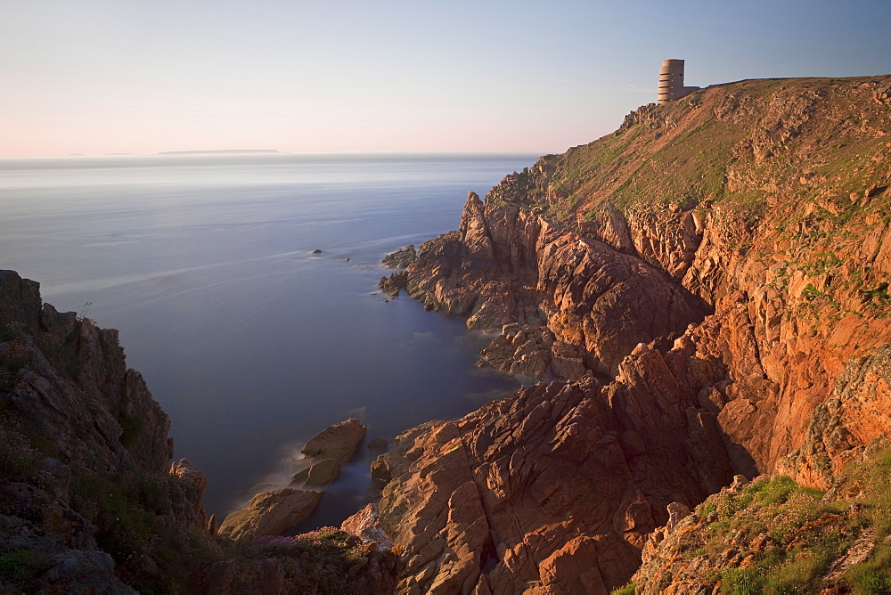 WWII German Observation tower and the rocky northwest coastline of Jersey, Channel Islands, United Kingdom, Europe