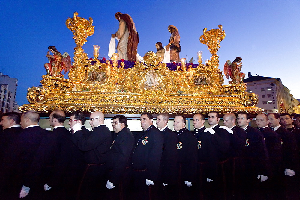 Religious float being carried through the streets during Semana Santa (Holy Week) celebrations, Malaga, Andalucia, Spain, Europe