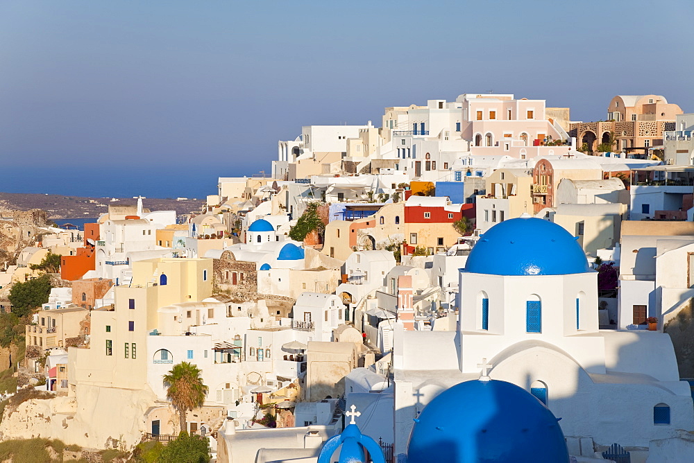 Blue domed churches in the village of Oia, Santorini (Thira), Cyclades Islands, Aegean Sea, Greek Islands, Greece, Europe