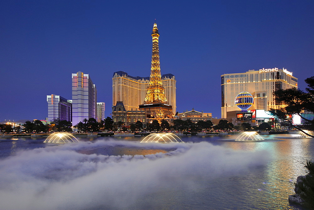 Bellagio fountains perform in front of the Eiffel Tower replica, Las Vegas, Nevada, United States of America, North America