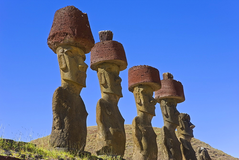 Anakena beach, monolithic giant stone Moai statues of Ahu Nau Nau, four of which have topknots, Rapa Nui (Easter Island), UNESCO World Heritage Site, Chile, South America