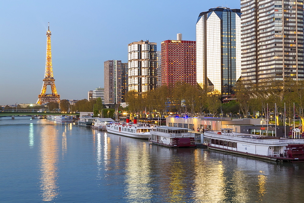 Night view of River Seine with high-rise buildings on the Left Bank, and Eiffel Tower, Paris, France, Europe