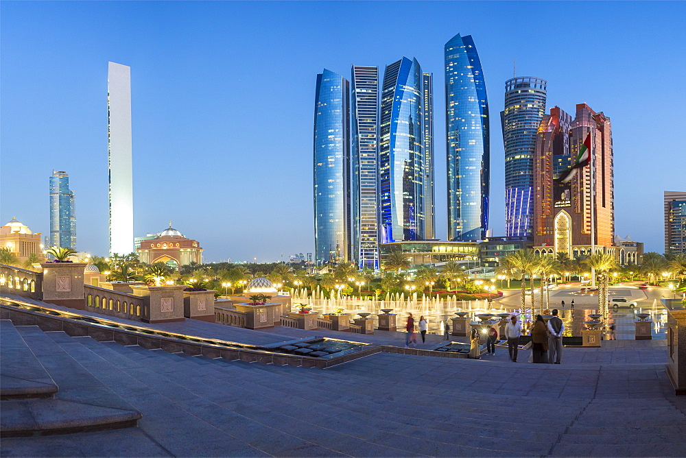 Etihad Towers viewed over the fountains of the Emirates Palace Hotel, Abu Dhabi, United Arab Emirates, Middle East