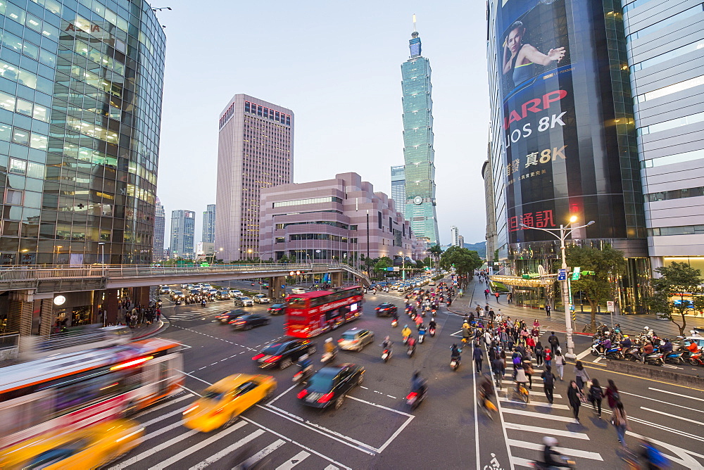 Traffic in front of Taipei 101 at a busy downtown intersection in the Xinyi district, Taipei, Taiwan, Asia