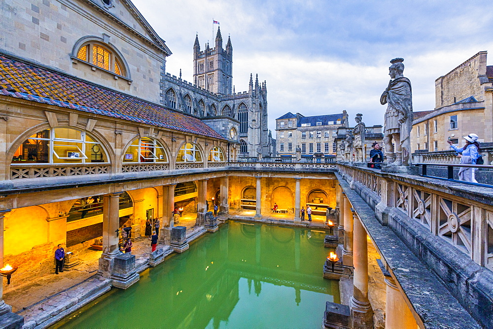 The Roman Baths and Bath Abbey illuminated at dusk, UNESCO World Heritage Site, Bath, Somerset, England, United Kingdom, Europe