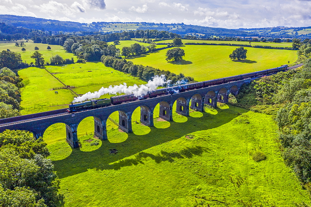 Steam locomotive crossing the Stanway Viaduct, Toddington, Gloucestershire, England, United Kingdom, Europe