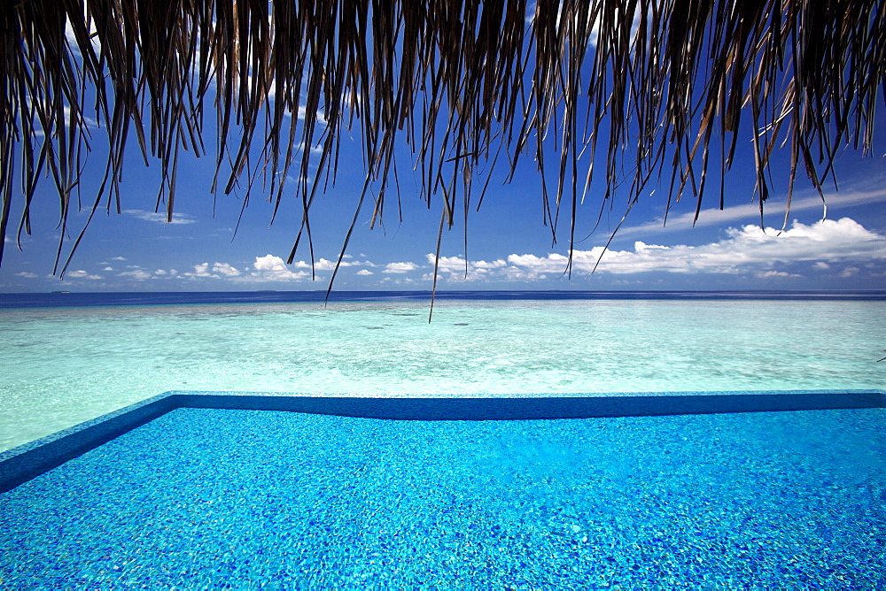 Infinity pool and lagoon, Maldives, Indian Ocean, Asia