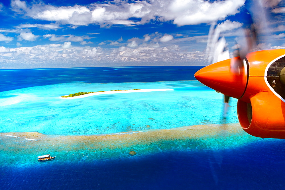 Aerial view of island and seaplane, Male Atoll, The Maldives, Indian Ocean, Asia