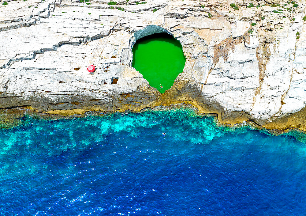 Aerial view of tourists bathing in the Giola, a natural pool on Thassos island, Greek Islands, Greece, Europe