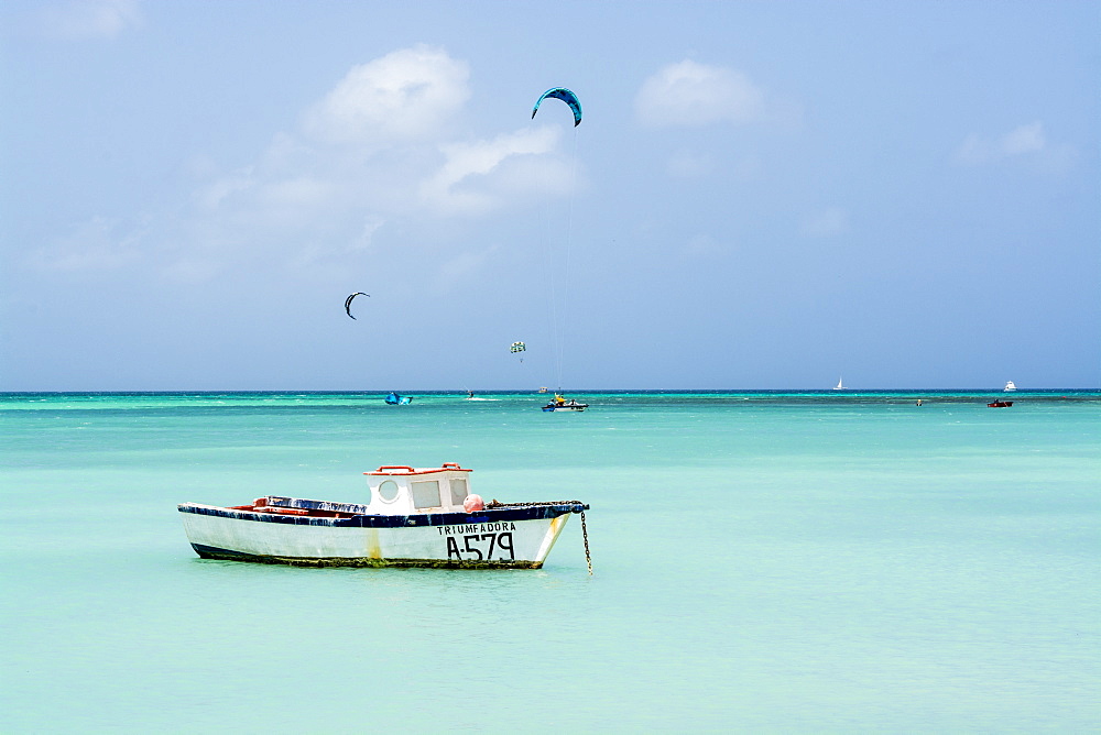 Fishing boat and windsurfing kitesurfing on Hadicurari Beach, Aruba, ABC Islands, Dutch Antilles, Caribbean, Central America