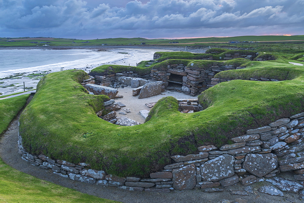 Stormy sky over Skara Brae, UNESSCO World Heritage Site, a Neolithic village on the Mainland of Orkney, Scotland, United Kingdom, Europe