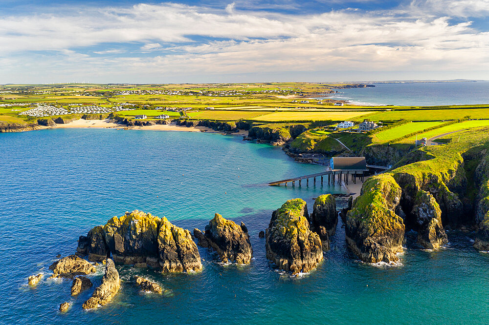 Aerial vista of Merope Rocks, Padstow Lifeboat Station and Mother Ivey's Bay, Cornwall, England, United Kingdom, Europe