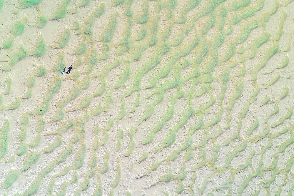 Aerial vista of people standing on the Doom Bar at low tide, Camel Estuary, Padstow, Cornwall, England, United Kingdom, Europe