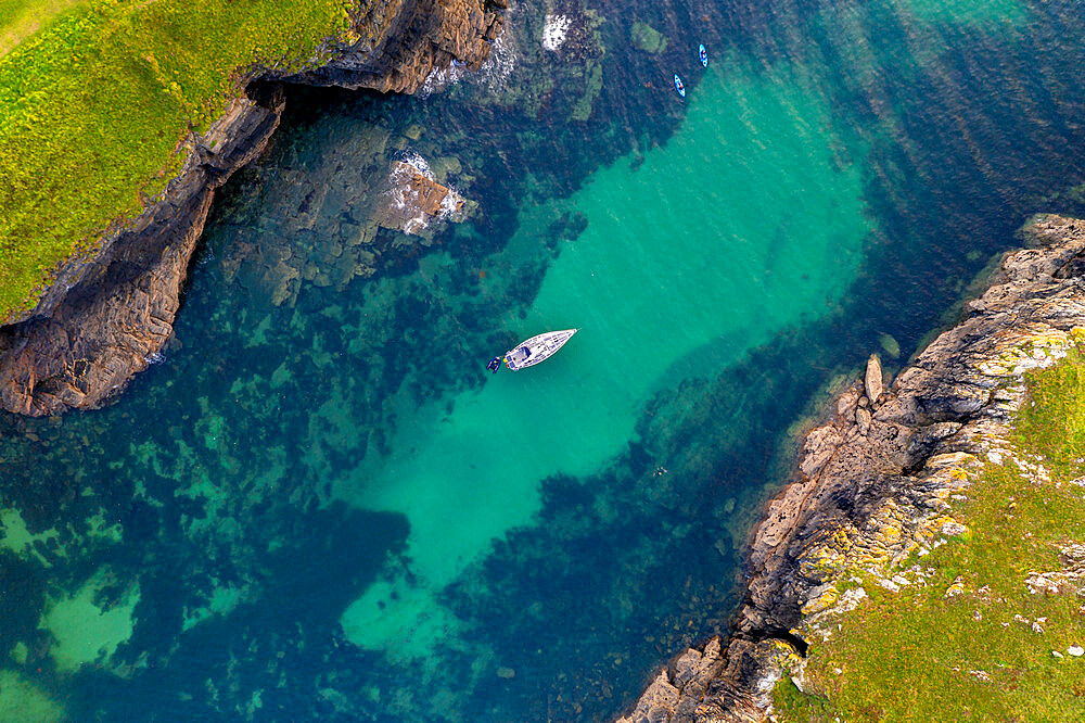 Aerial view of a yacht moored in Port Quin, Cornwall, England, United Kingdom, Europe