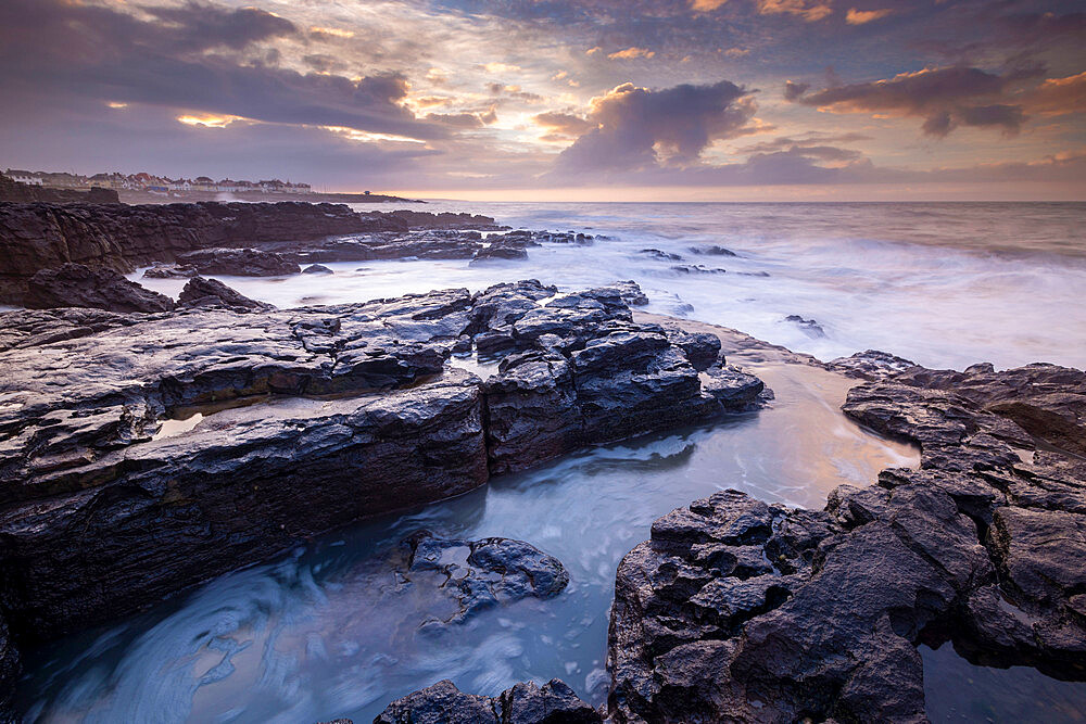 Sunrise over the dramatic rocky coastline of Porthcawl in winter, South Wales, United Kingdom, Europe