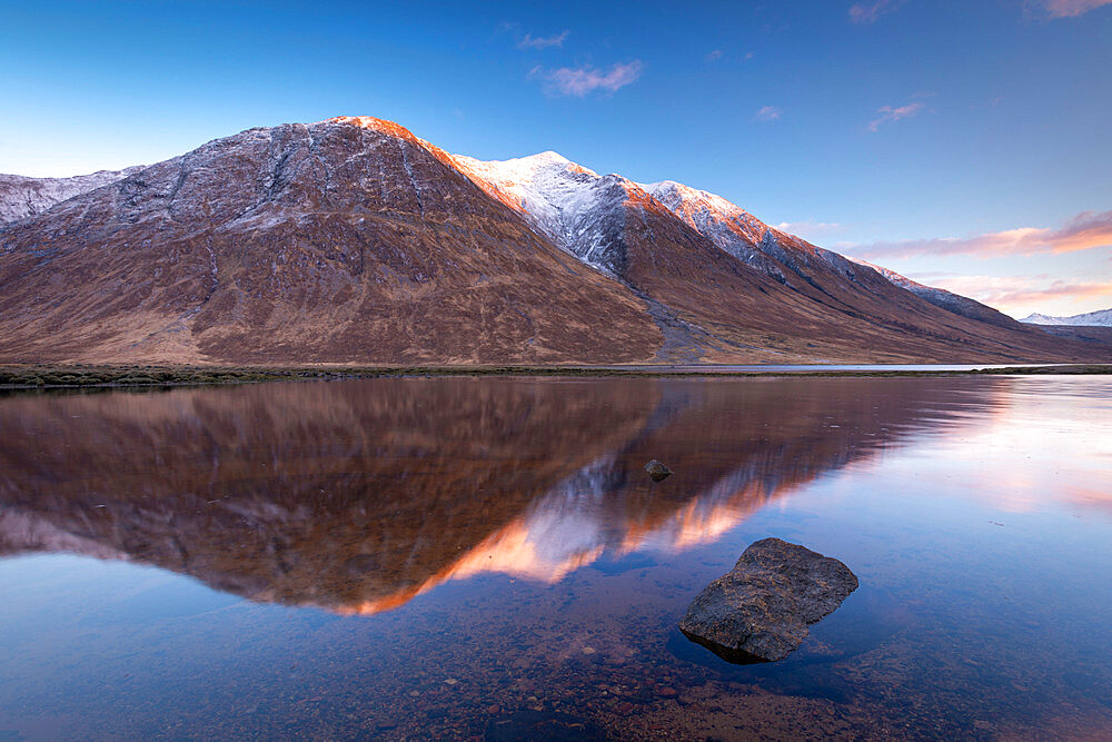 Snow capped Highlands mountains reflected in the calm waters of Loch Etive in winter, Highlands, Scotland, United Kingdom, Europe