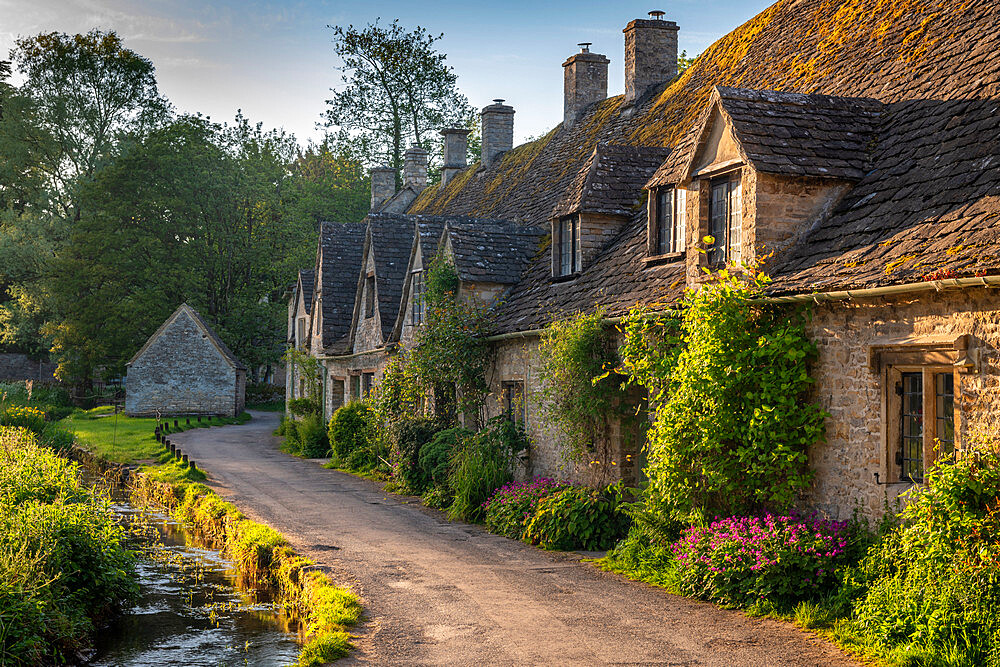 Early Spring morning view of the beautiful Cotswolds cottages at Arlington Row in Bibury, Gloucestershire, England, United Kingdom, Europe