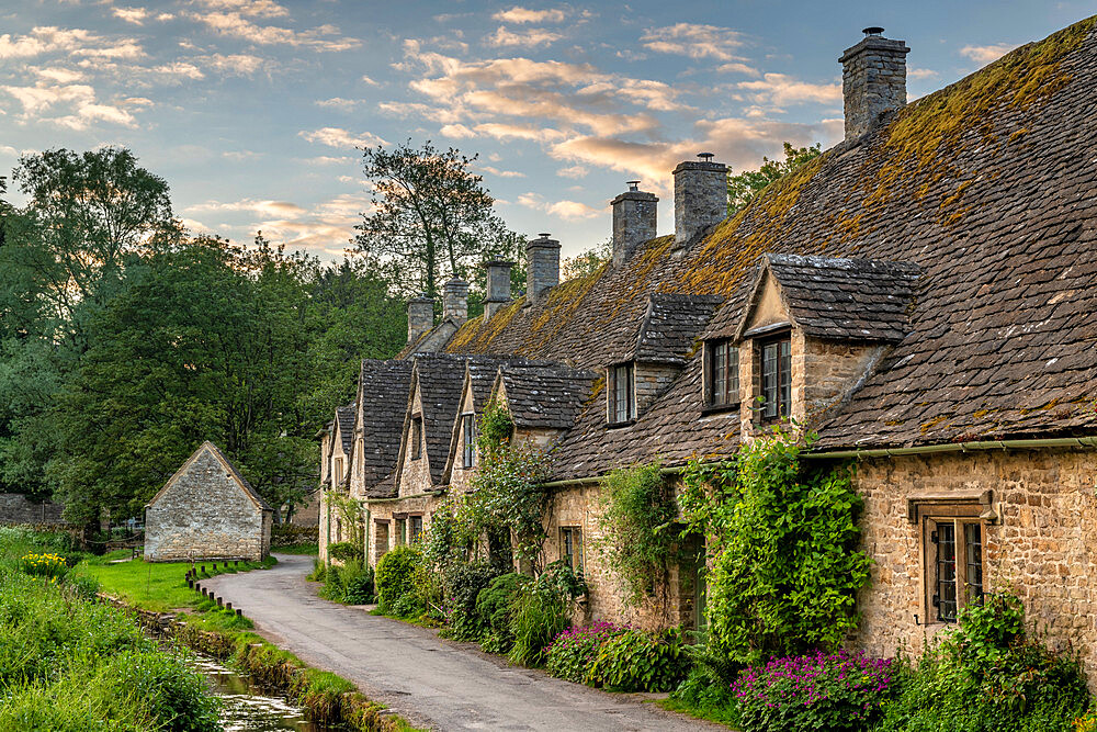 Early Spring morning view of the beautiful Cotswolds cottages at Arlington Row in Bibury, Gloucestershire, England, United Kingdom, Europe