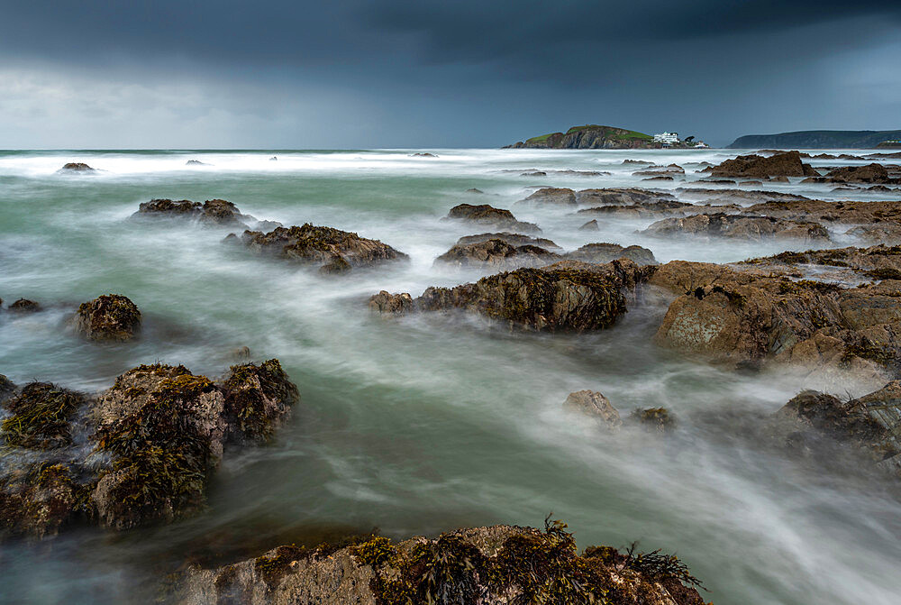 Stormy conditions on the rocky Bantham coast in autumn, looking across to Burgh Island, Devon, England, United Kingdom, Europe