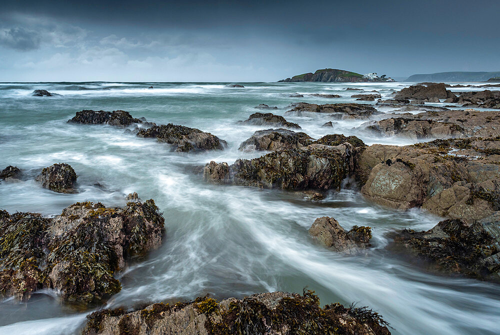 Stormy conditions on the rocky Bantham coast, looking across to Burgh Island, Devon, England, United Kingdom, Europe