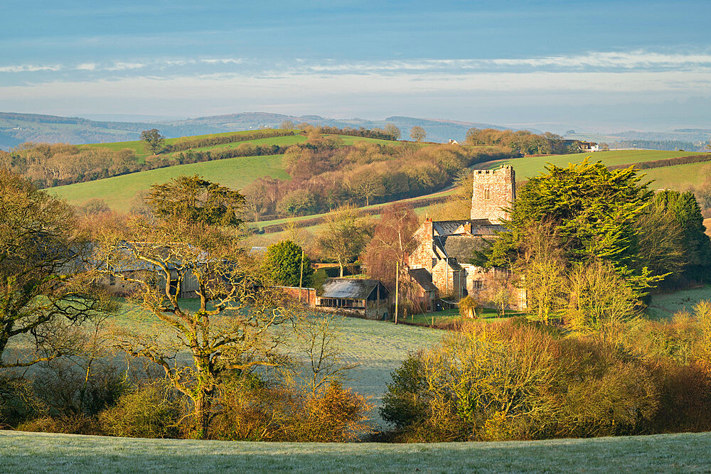 Church of St. John the Baptist at Holcombe Burnell Barton, surrounded by countryside in winter, Longdown, Devon, England, United Kingdom, Europe