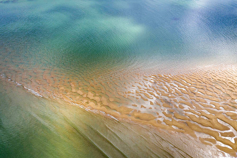 Aerial photograph of the Doom Bar emerging from the Camel Estuary at low tide in spring, Padstow, Cornwall, England, United Kingdom, Europe