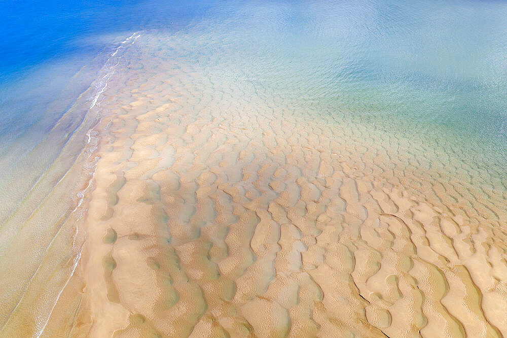 Aerial photograph of the Doom Bar emerging from the Camel Estuary at low tide in spring, Padstow, Cornwall, England, United Kingdom, Europe