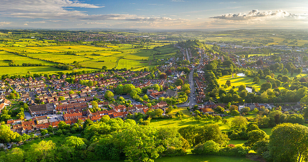 Aerial view of Glastonbury on a sunny summer evening, Somerset, England, United Kingdom, Europe