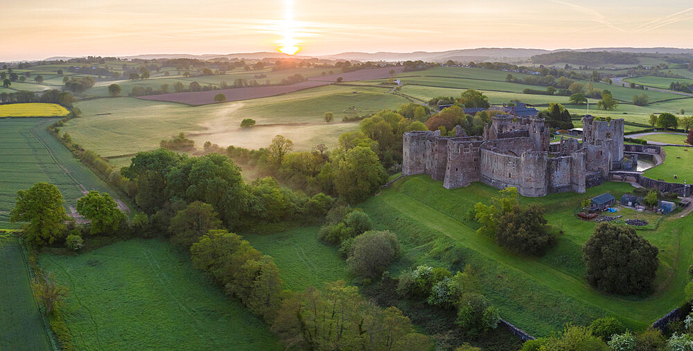 Aerial view of Raglan Castle at dawn, Raglan, Monmouthshire, Wales, United Kingdom, Europe