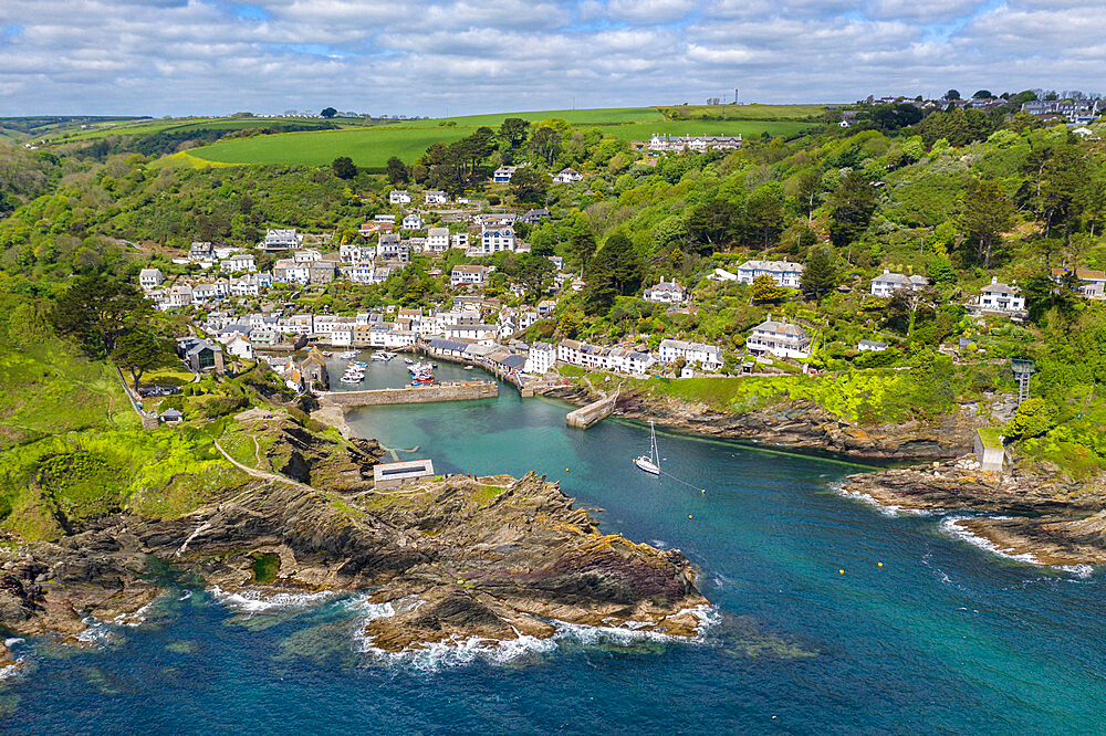 Aerial view of Polperro fishing village and harbour on a sunny spring afternoon, Cornwall, England, United Kingdom, Europe