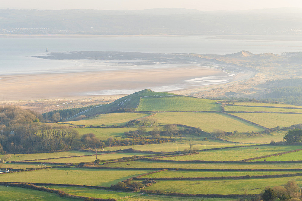 Vista over farmland to Whiteford Sands and Lighthouse in spring, Gower Peninsula, South Wales, United Kingdom, Europe