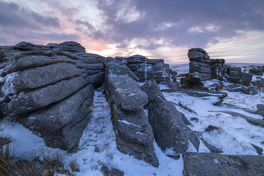 Sunrise over a snow covered East Mill Tor in winter, Dartmoor, Devon, England, United Kingdom, Europe